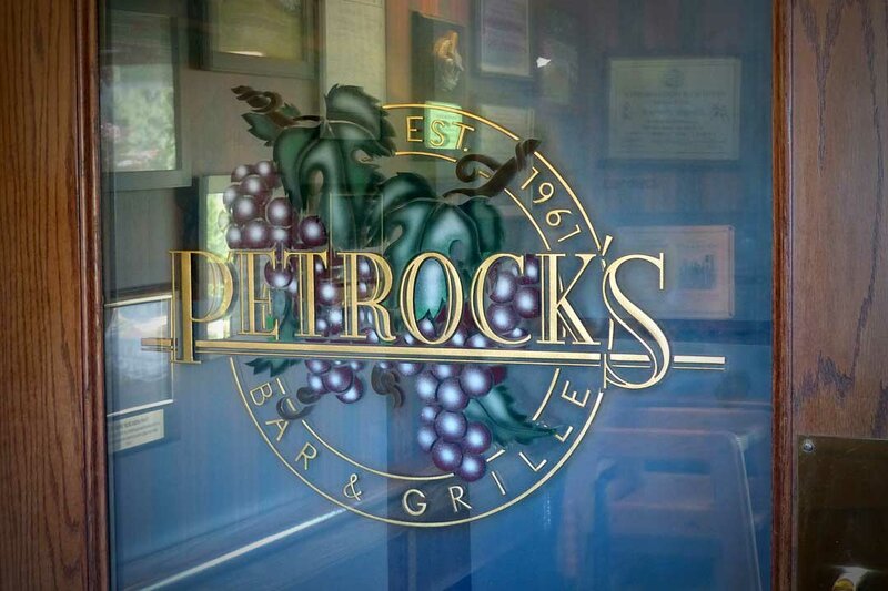 Restaurant logo painted on glass door